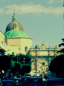 Domes of the Duomo and another church just inside the Garibaldi Gate, along with the Porta Garibaldi itself.