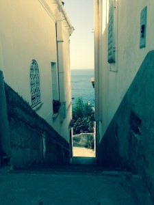 Steps in alleyway looking down to the sea