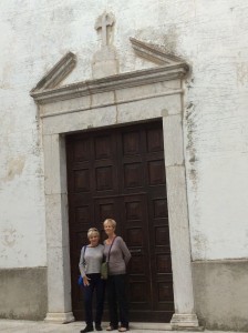 Connie and Fran at the door to the church where their mother’s family prayed and records are maintained at the top of the hill in Monteferrante — their roots!