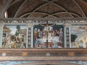 Looking over the wall above the crucifix, you can see the section of this building that is the church. The frescos by Bernardino Luini, a follower of Michelangelo and Raphael, fill the walls on both sides.