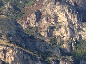 Amalfi Coast Highway before reaching Positano as it comes to the seaside. It really hugs the cliffs.