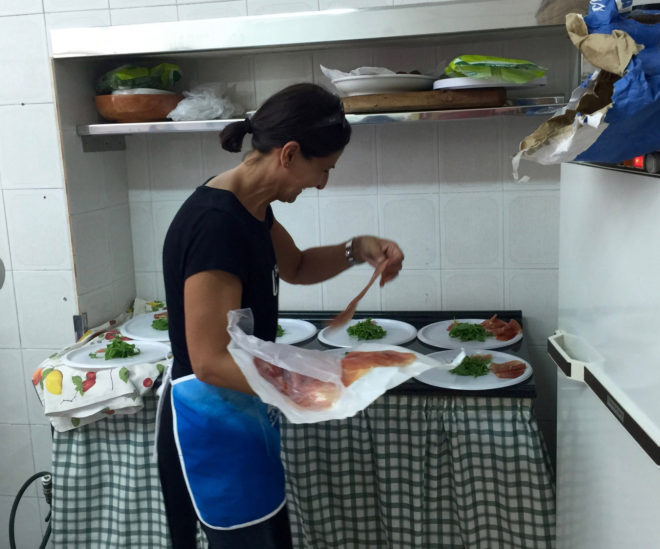 Cinzia is busy in the kitchen as well.