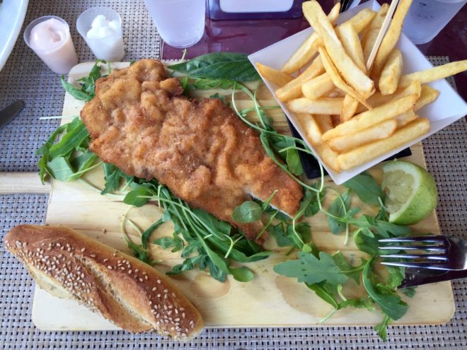 My lunch of chicken cutlet on arugula along with fries