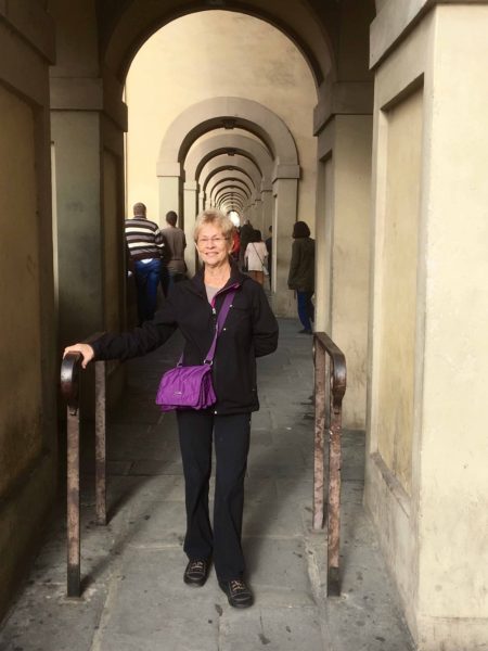 Fran in the covered archway along the Arno River.