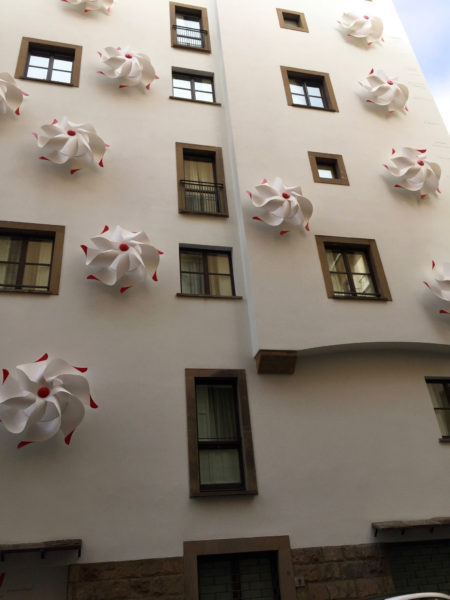 Hotel with its exterior walls decorated with large pinwheels.