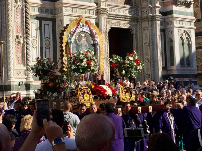 A procession honoring Mary and Jesus proceeding from the Duomo.