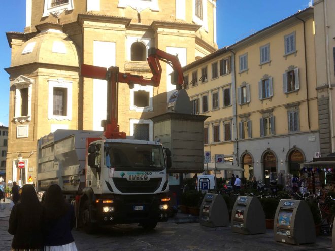 Florence is a very clean city, and big on recycling. The container you see is actually located below the surface and the trucks lift up the container, move it over the truck, and empty it.