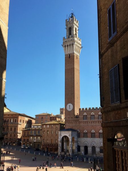 Torre del Mangia - the main worker is said to have exclaimed that he builds to eat, hence the name. Notice also the stone poles that form the inner boundary of the race track.