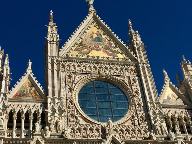 Three large mosaics on the gables of the façade were made in Venice in 1878. The large central mosaic, the Coronation of the Virgin