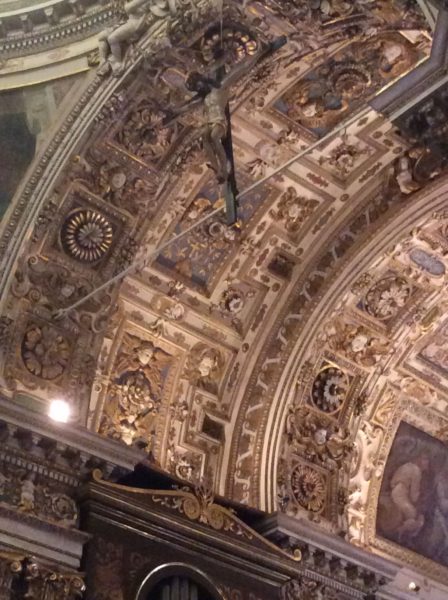 The cricifix hung almost up to the ceiling of above the altar of the Chiesa di San Vittore al Corpo. We assumed it is lowered for certain celebrations. Notice also the ceiling decoration.